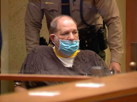 In this image taken from KABC pool video, Harvey Weinstein, the 69-year-old convicted rapist and disgraced movie mogul, arrives in a wheelchair to an arraignment hearing, Wednesday, July 21, 2021, in Los Angeles. Weinstein pleaded not guilty Wednesday to four counts of rape and seven other sexual assault counts in California.