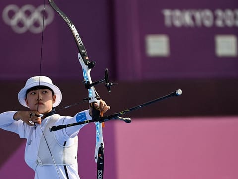 South Korea's An San competes in the mixed team event Yumenoshima Park Archery Field