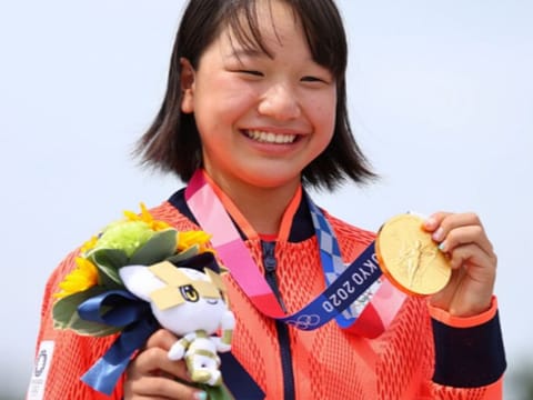 13-year-old Momiji Nishiya of Japan with the gold medal for the women's street skateboard at Ariake Urban Sports Park.