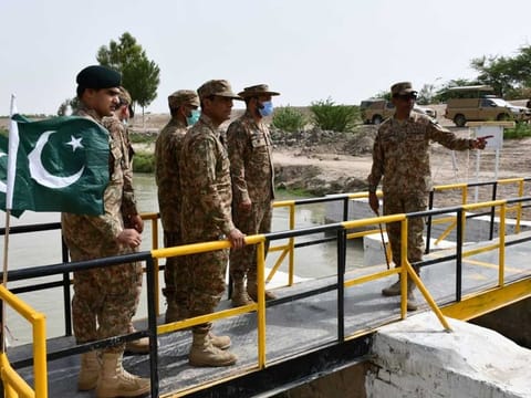 Pakistan Army officers inspect the new pedestrian bridge near Indus River after its inauguration.