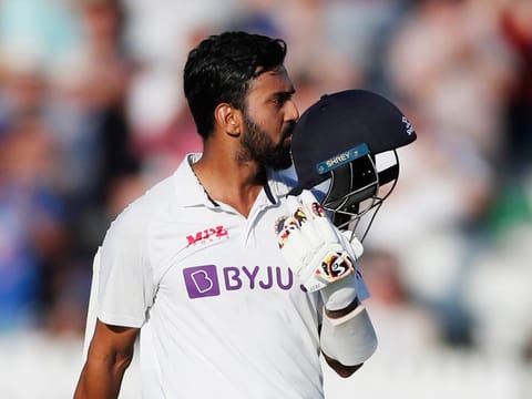 India's KL Rahul kisses the badge on his helmet as he celebrates scoring a century on the first day of the second cricket Test against England at Lord's cricket ground in London on August 12, 2021.