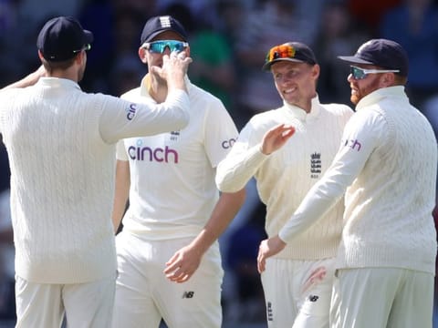 England captain Joe Root (second right) celebrates the fall of Virat Kohli's wicket on the fourth day of the third Test at Headingley on Saturday.