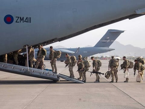 A handout picture released by the British Ministry of Defence (MOD) shows British military personnel boarding a Royal Air Force (RAF) A400M aircraft ahead of departing Kabul Airport on August 28, 2021 where they had been deployed as part of Operation PITTING to evacuate British nationals and eligible Afghans under the Afghan Relocation and Assistance Program (ARAP).