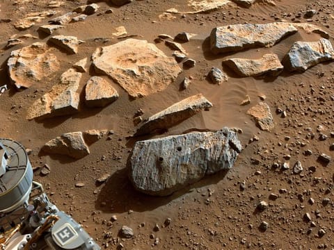 In image released by NASA and taken by NASA's Perseverance rover on September 7, 2021, two holes where the rover's drill obtained chalk-size samples from rock nicknamed "Rochette."