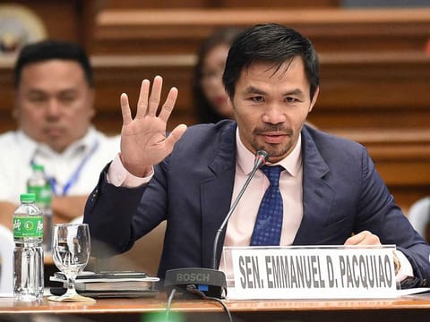 This file photo taken on March 6, 2017 shows Philippine boxing icon and senator Manny Pacquiao during a senate hearing in Manila. Philippine boxer-turned-politician Manny Pacquiao declared on September 19, 2021 he will run for president in 2022, ending months of speculation about whether the legendary fighter would seek the country's top job.