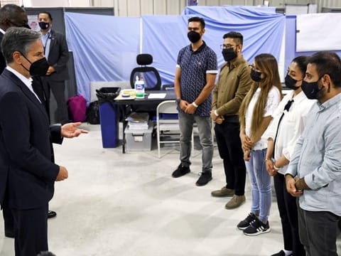 US Secretary of State Antony Blinken and US Secretary of Defence Lloyd Austin meet with Afghan interpreters at Al Udeid Air Base which houses Afghan refugees, in Doha, on September 7, 2021. UK Prime Minister Boris Johnson earlier this month said 311 people were left behind who were eligible under the UK’s Afghan Relocations and Assistance Policy, such as interpreters.