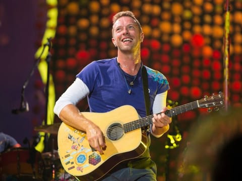 Chris Martin of Coldplay performs at Metlife Stadium on Tuesday, August 1, 2017.