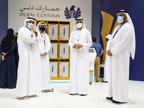Dubai Customs officials with the I-Box lockers at GITEX 2021.