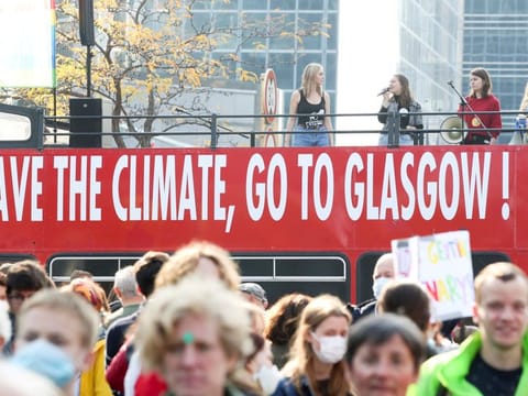 People take part in a Climate March ahead of the COP26 climate summit, in Brussels, Belgium October 10, 2021.