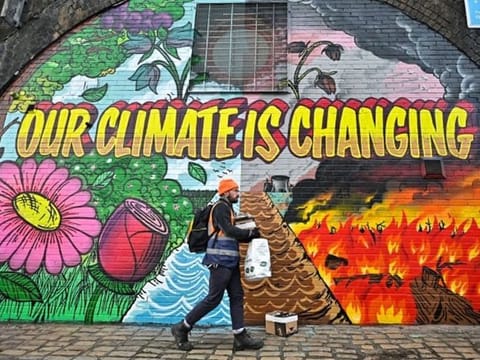 Artists painted this mural on a wall near the Scottish Events Centre, in Glasgow, Scotland, which will be hosting the COP26 UN Climate Summit