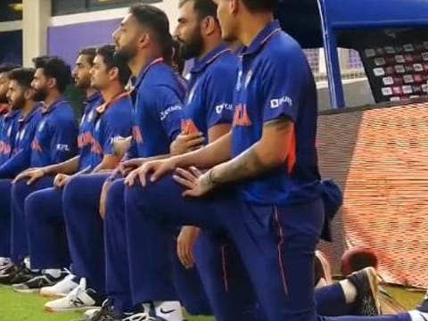 Team Indian players took a knee before their Super 12 match against Pakistan in Dubai