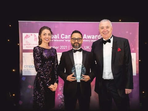 Luthfur Khan, Wholesale Representative, Kalaam Group, Europe Division (centre), with Melanie Mingus, Editor, Capacity Media, and Carl Roberts, Chair of the Judging Panel