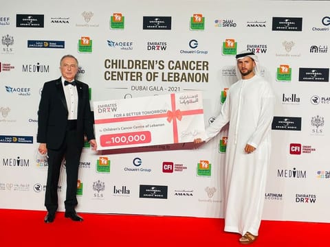 Mohammad Alawadhi, managing partner of Emirates Draw, presenting the cheque to Dr Cesar Bassim, chairman of CCCL.