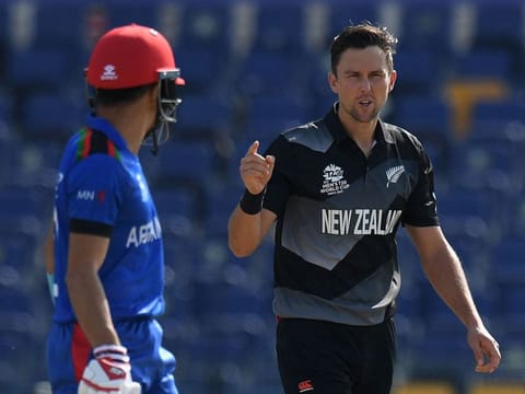 Man of the Match Trent Boult (right) celebrates after taking the wicket of Afghanistan's Hazratullah Zazai.