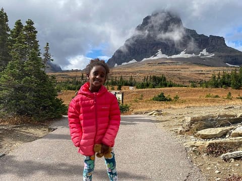 Five-year-old Naomi Pascal, holding her teddy bear, is pictured on a hike to Hidden Lake in Glacier National Park, Mont., in October 2020.