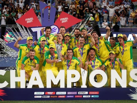 Australia captain Aaron Finch celebrates with the trophy and teammates after winning the ICC Men's T20 World Cup final at the Dubai International Cricket Stadium, in Dubai, UAE. The Aussies beat New Zealand by eight wickets.