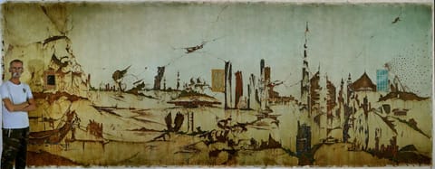Akbar Saheb with his oil-on-canvas which measures 18 feet X 7 feet and is entitled Past, Present and Future.