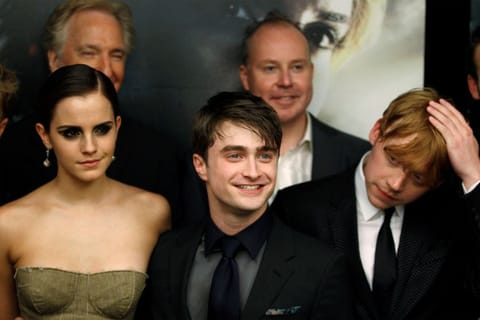 FILE PHOTO: Cast members Rupert Grint (R), Daniel Radcliffe and Emma Watson (L) arrive for the premiere of the film "Harry Potter and the Deathly Hallows: Part 2" in New York July 11, 2011. REUTERS/Lucas Jackson/File Photo