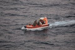 A handout picture provided by the US Navy on November 28, 2021, shows personnel from dry cargo ship USNS Charles Drew (T-AKE 10) transporting an Iranian mariner a day earlier after receiving a request for assistance from two mariners in the Gulf of Oman whose fishing vessel had been adrift at sea for eight days.