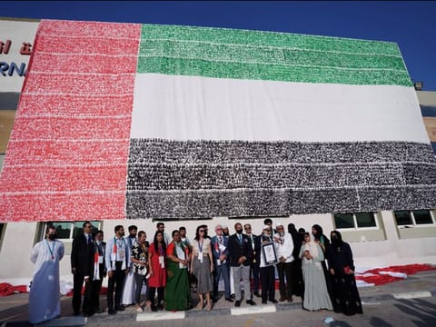 The massive UAE flag mural created by the members of PACE Education Group.
