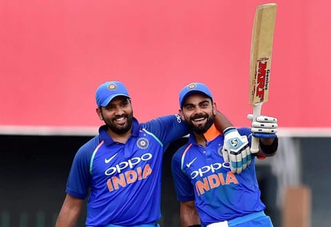 Virat Kohli celebrates his century with Rohit Sharma against Sri Lanka.