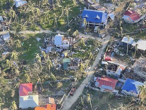 This aerial handout photo received from the Philippine Army on December 18 shows destroyed houses caused by Super Typhoon Rai after the storm crossed over General Luna, Siargao Island.