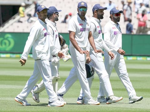 Indian players walk from the field after dimissing Australia for 200 runs in their second innings during play on day four of the second Test at the Melbourne Cricket Ground.