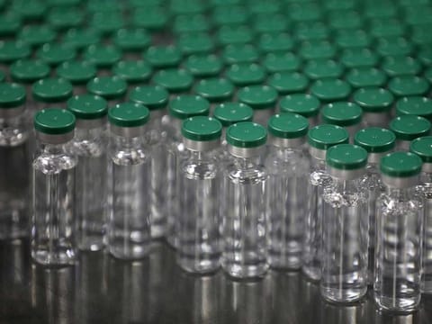 Vials of AstraZeneca's COVISHIELD, coronavirus disease (COVID-19) vaccine, are seen before they are packaged inside a lab at Serum Institute of India, Pune, India