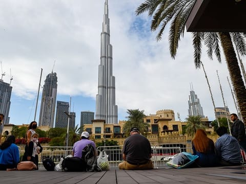 Residents and tourists at Dubai mall, Burj Khalifa