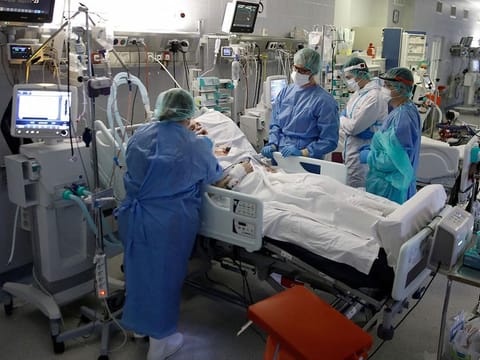 Medical staff members treat patients inside the coronavirus disease (COVID-19) ward at the Central Clinical Hospital of the Ministry of Interior and Administration in Warsaw, Poland.