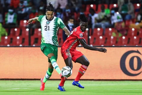 Nigeria's defender Tyronne Ebuehi (left) fights for the ball with Guinea-Bissau's forward Piqueti during the Group D Africa Cup of Nations match between Guinea-Bissau and Nigeria at Stade Roumde Adjia in Garoua. The knockout stages begin tomorrow with Nigeria - the only side to win all three group games - playing Tunisia in one of the ties of the last 16.