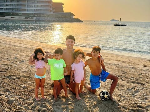 Cristiano Ronaldo plays the doting father with his children at a Dubai beachfront.