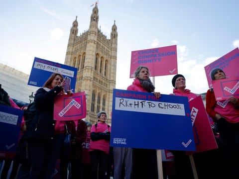 'Dignity in Dying' supporters gather to call for a change in the law to support assisted dying outside the Houses of Parliament in central London in a file photo.