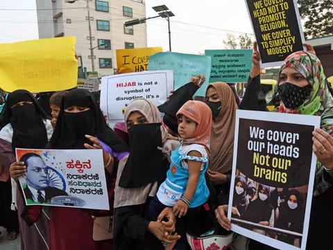 Muslim women hold placards in favour of Hijab in Bengaluru on Monday.