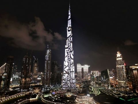 Burj Khalifa lit up in dazzling display of Arabic calligraphy to welcome the soon-to-open Museum of the Future.