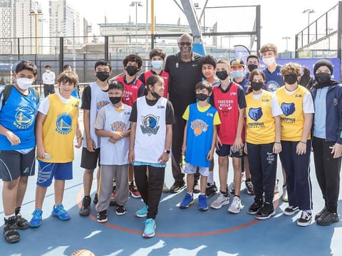 10-time NBA All-Star Clyde Drexler with some of the school children with their respective jerseys during the announcement of the Jr. NBA Legue, to begin in Abu Dhabi on March 5.