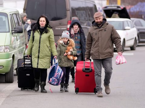 Refugees from Ukraine arrive to the border crossing Vysne Nemecke, Slovakia, Tuesday, March 1, 2022.