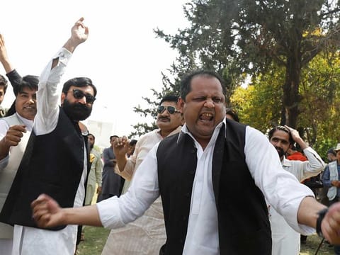 Supporters of the Pakistan Muslim League-Nawaz (PML-N) react as they protest against Prime Minister Imran Khan, outside the parliament building in Islamabad, Pakistan April 9, 2022.