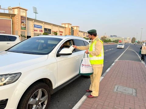 Dubai Police and volunteers are handing out meals to motorists shortly before iftar so they don't have to rush home to end the day's fast at sunset