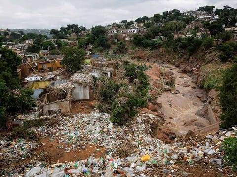 Destroyed homes and rubbish are seen after a river burst its banks in Ntuzuma, Durban, South Africa, on April 13, 2022.