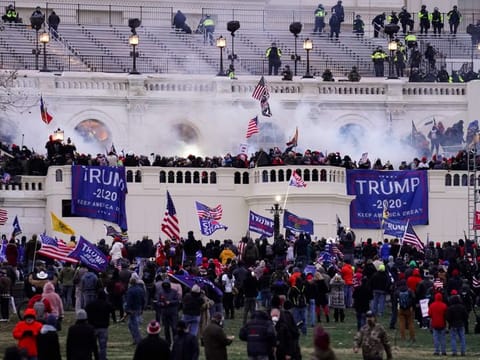 Violent insurrectionists loyal to President Donald Trump storm the Capitol, Jan. 6, 2021, in Washington.