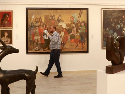 Restored art pieces by renowned Iraqi artists are on display at Iraq's Ministry of Culture in Baghdad on April 6, 2022.
