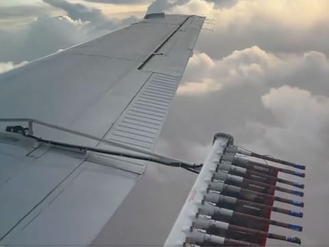 Cloud seeding is a process of artificially generating rain using aircraft to add small particles with a structure similar to ice to clouds, increasing the chance of precipitation and formation of water droplets and snowflakes.