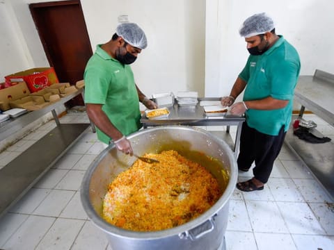 Workers packing Iftar meals at Al Khair kitchen.