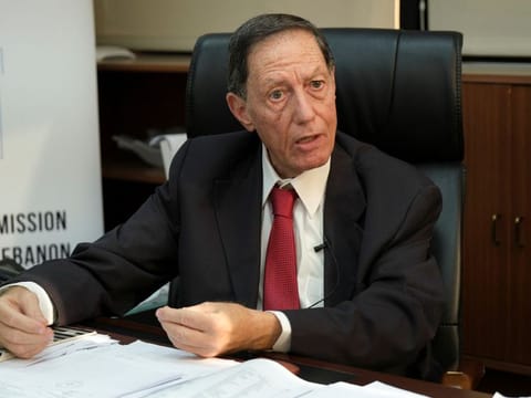 Nadim Abdul Malak, head of Lebanon's election commission gestures as he talks during an interview with Reuters at his office in Beirut, on April 27, 2022.