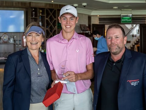 Abu Dhabi Golf Club's Thomas Nesbitt, winner of April's Phoenix Aerospace Monthly Medal, flanked by Men's and Ladies' Club Captains, Sally Hardman (left) and Matty Dolan.