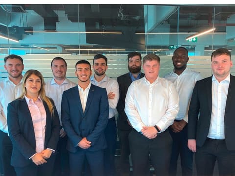 Sophia Bhatti, front left, with the eight graduates undergoing training at the academy.