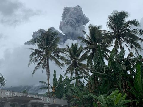 Ash and steam are spewed from Mount Bulusan.