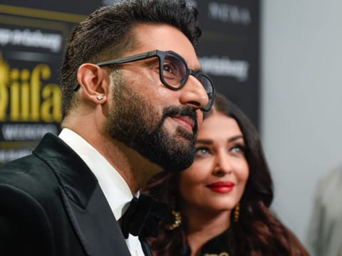 Aishwarya Rai Bachchan and Abhishek Bachchan arrive at IIFA green carpet at Etihad Arena in Abu Dhabi on Saturday night.