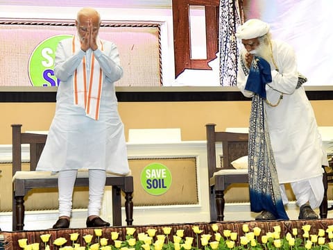 Prime Minister Narendra Modi with Yoga Guru Sadhguru greets at the 'Save Soil Movement' programme on the occasion of World Environment Day, at Vigyan Bhawan, in New Delhi on Sunday